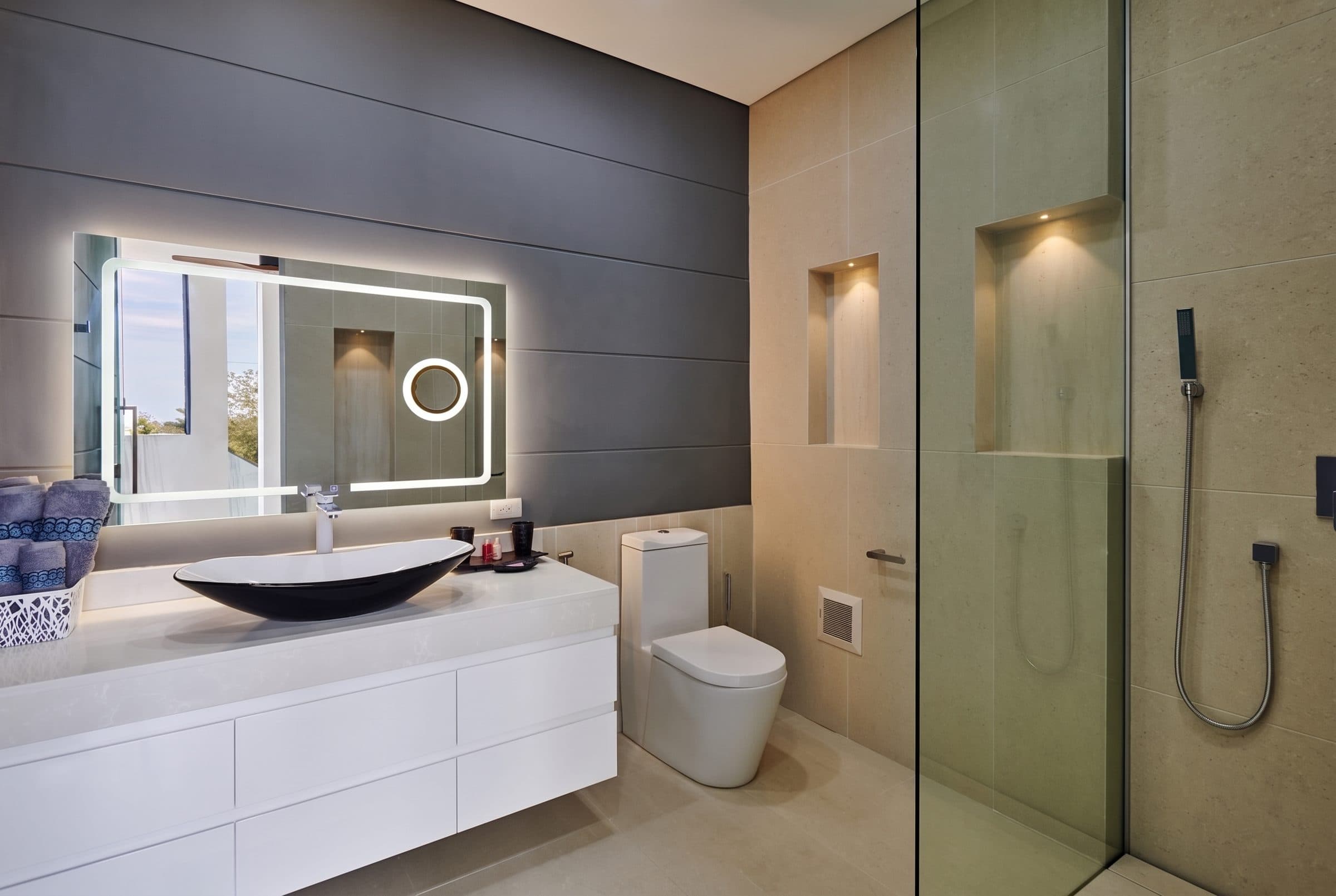 Bathroom with vessel basin, LED mirror and walk-in shower
