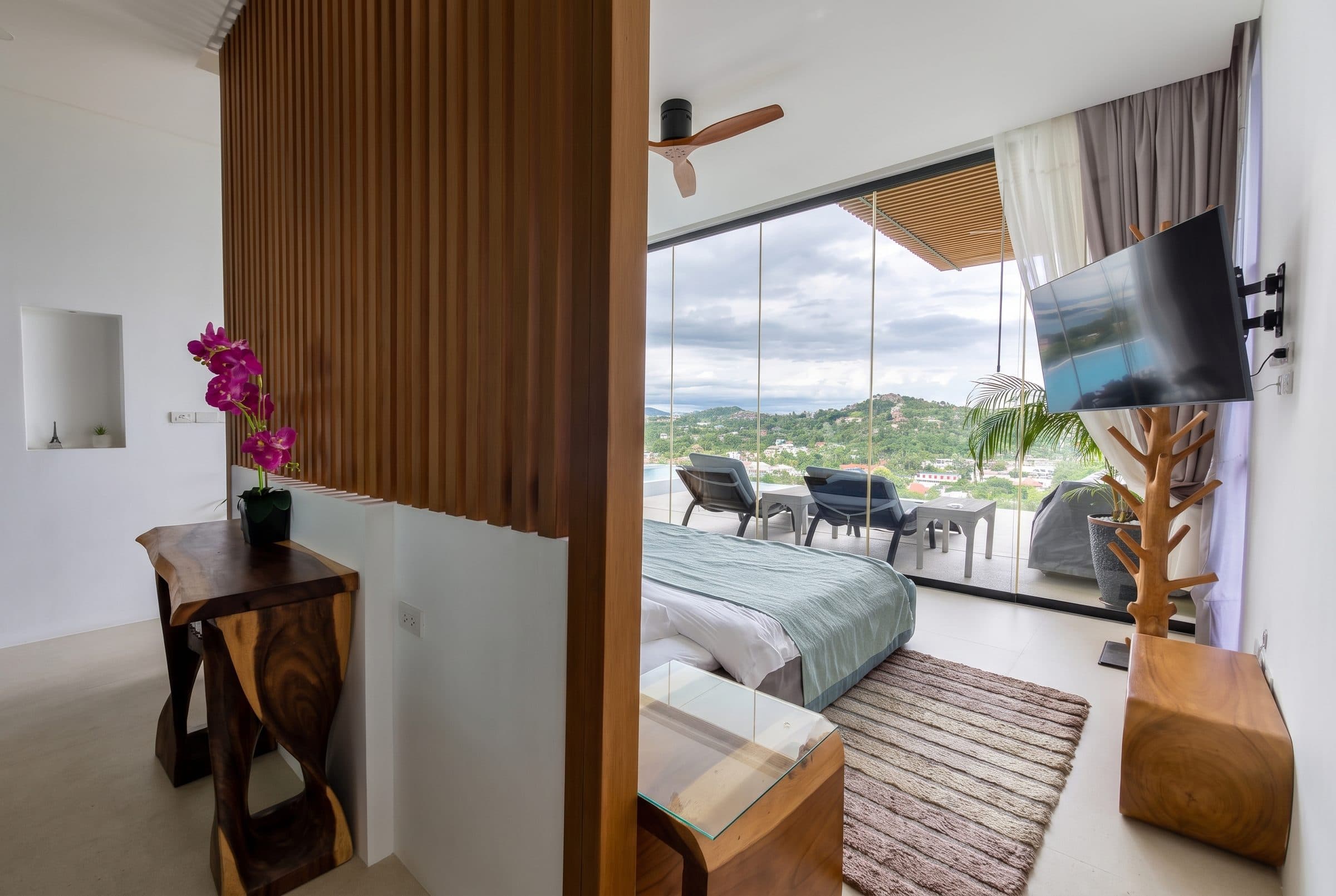 Bedroom with timber slats and terrace view