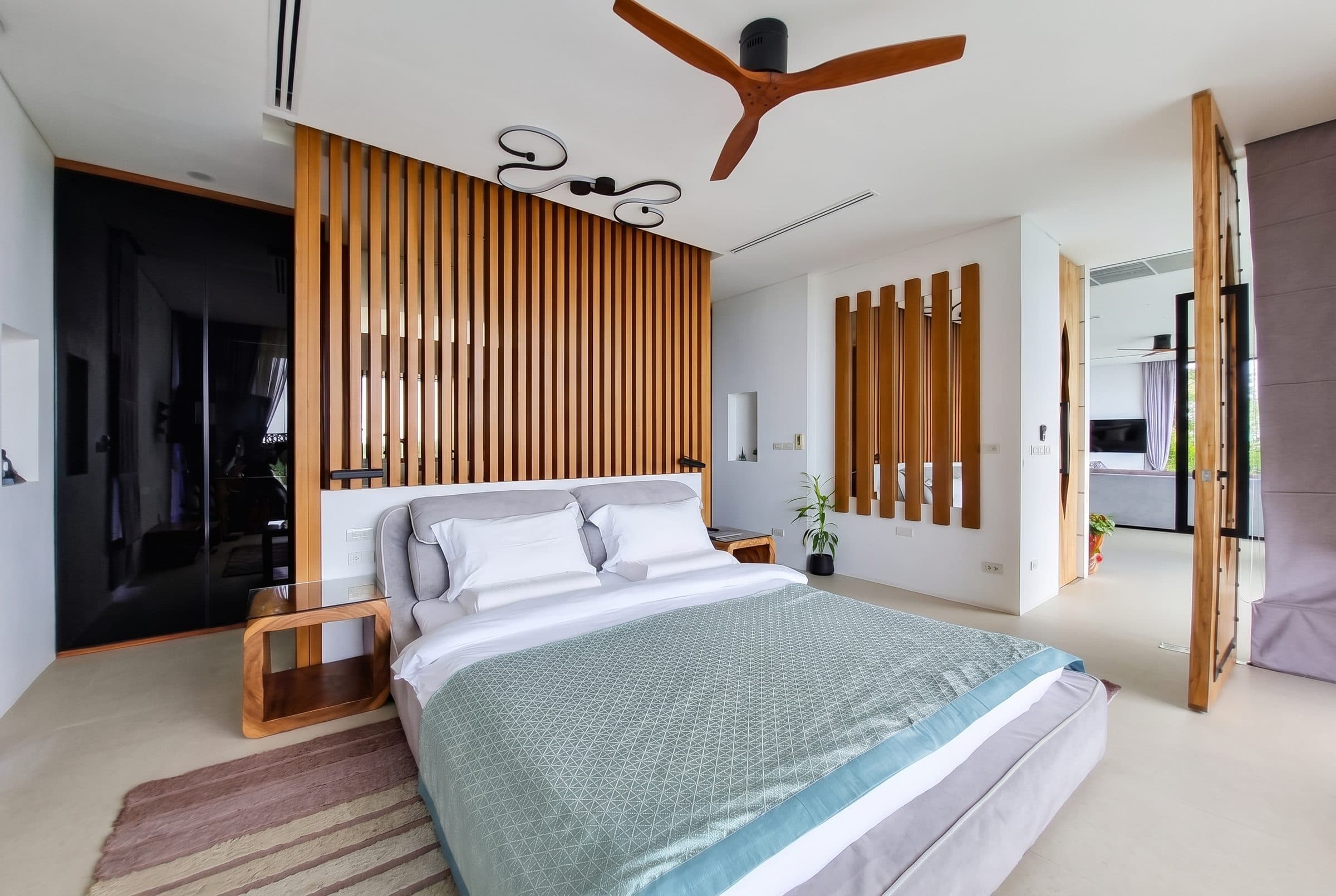Bedroom with timber slat divider