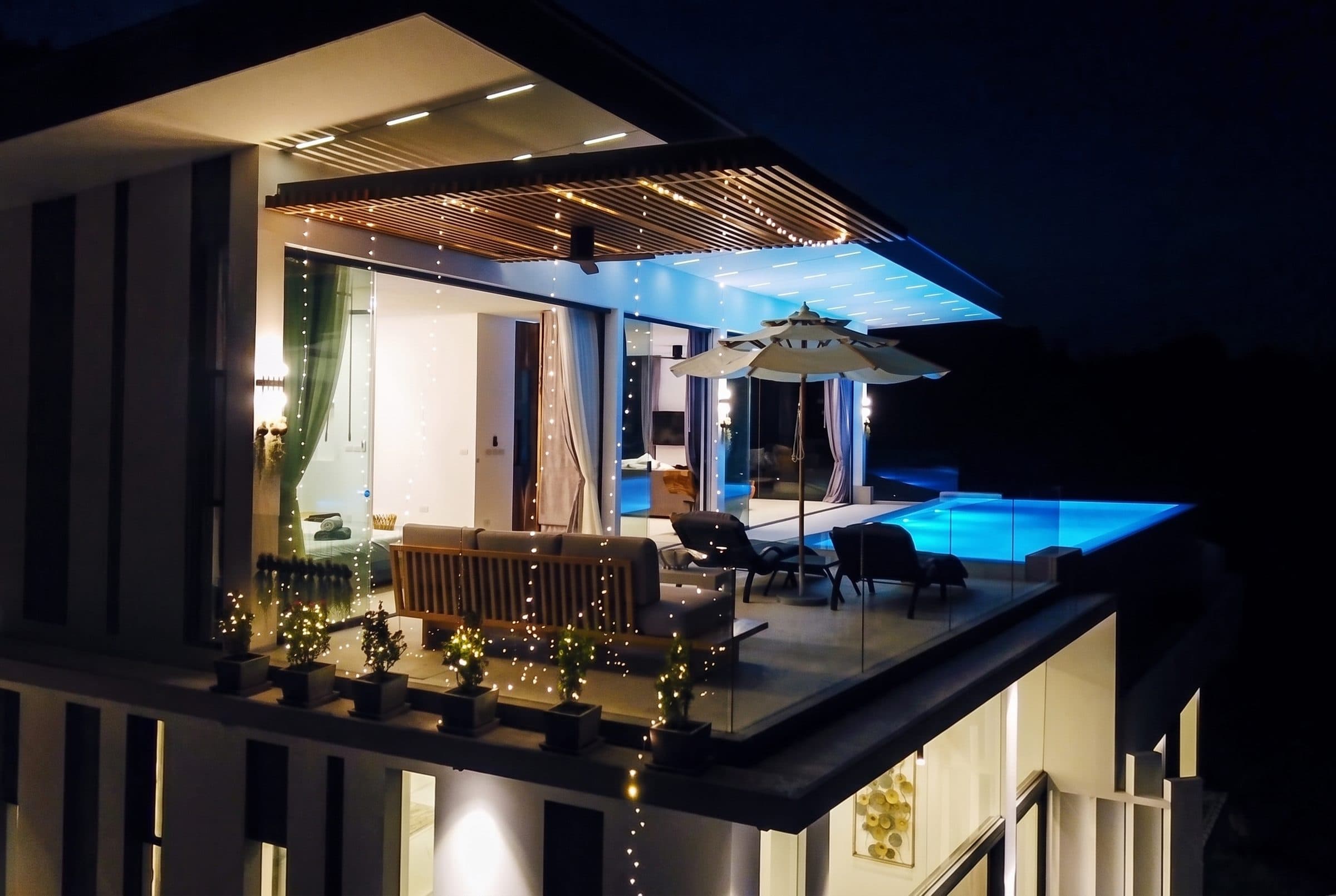 Penthouse terrace and pool lit up at night