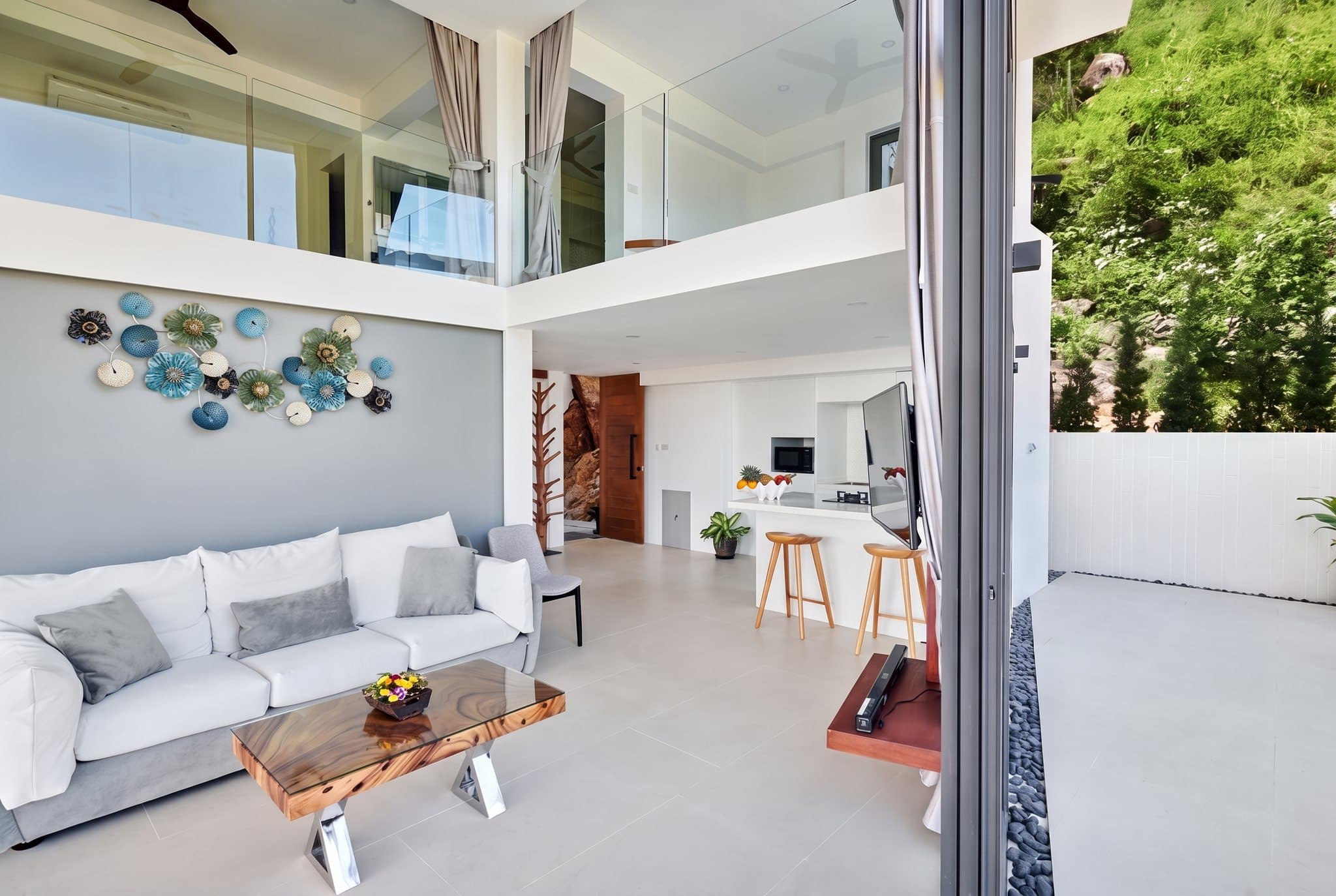 Seaview 2BR villa double-height living room and kitchen