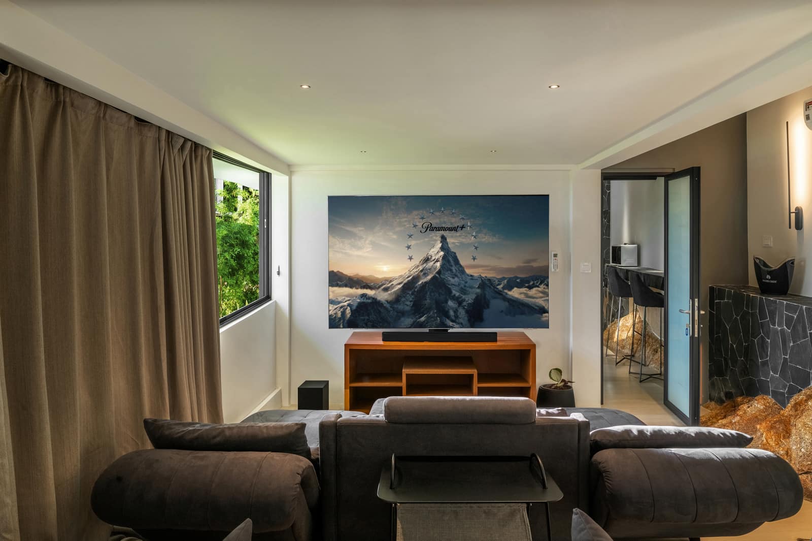 Lower-level lounge with home cinema screen