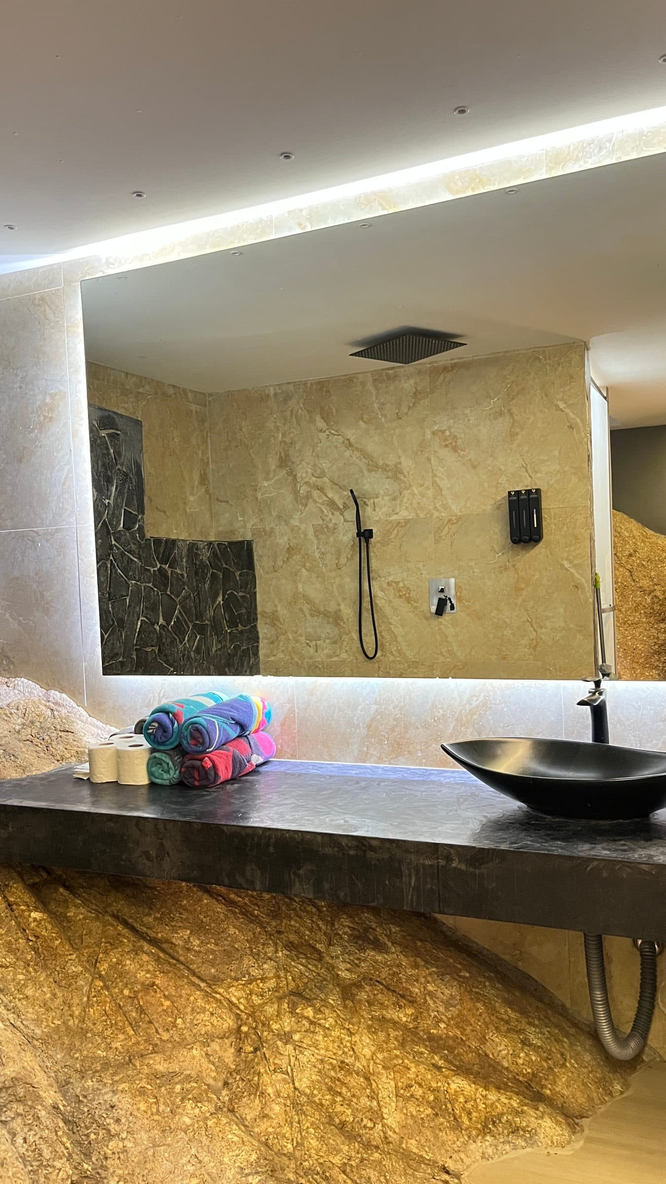 Vessel basin on a natural-rock vanity