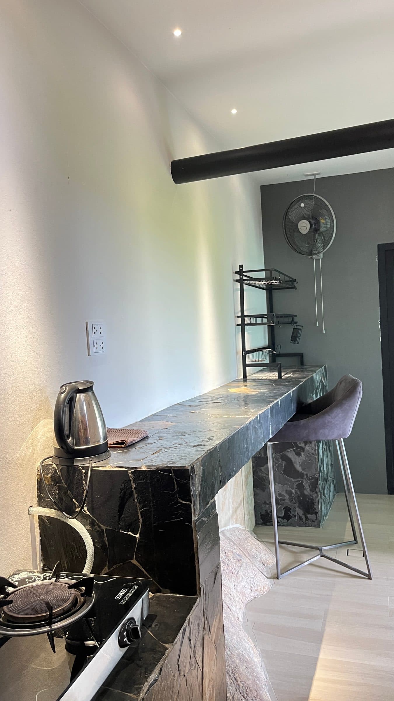 Kitchenette bar counter with hob and kettle