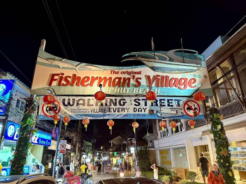 The Fisherman's Village walking street entrance at night