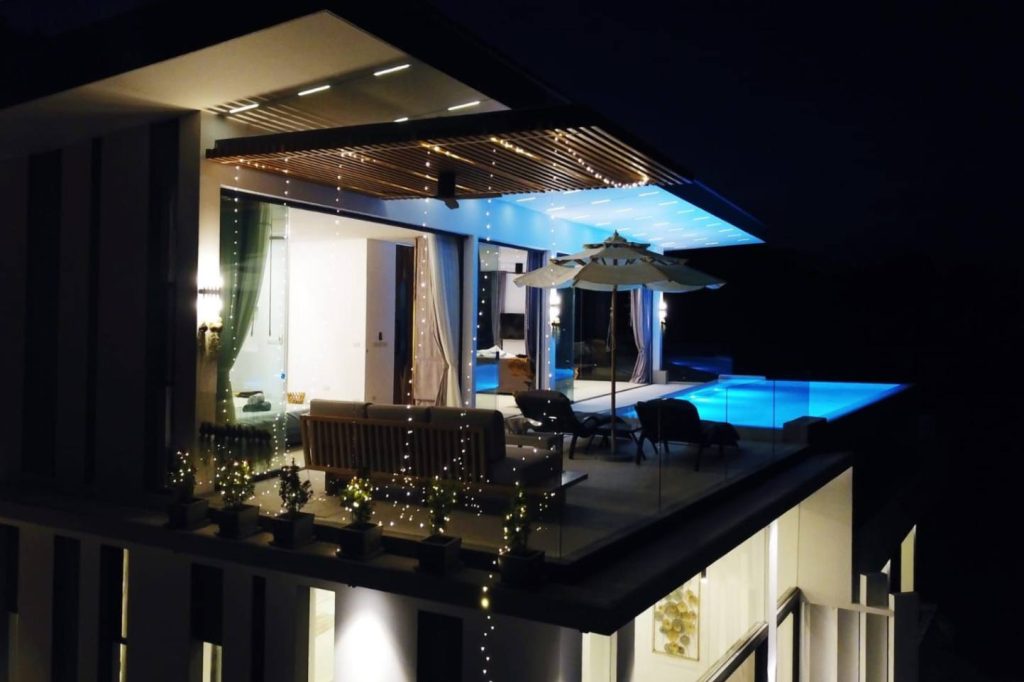 Outside view of the Magic Suites Private Pool villa at night