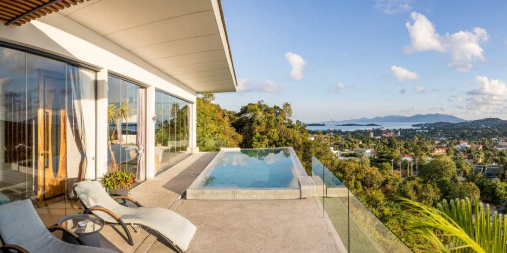 Rooftop swimming pool area in the Magic Honeymoon Suite during a bright, sunny day.