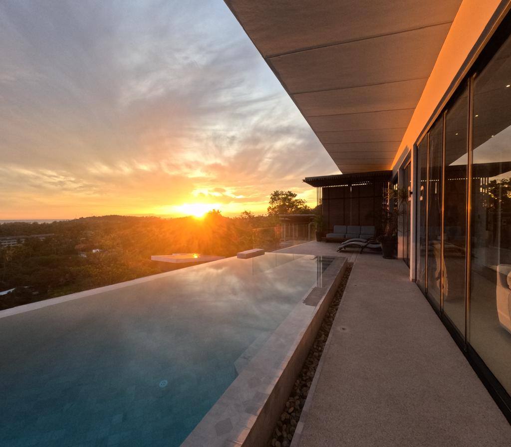 Breathtaking view of the setting sun from a pool area of Magic Suites.