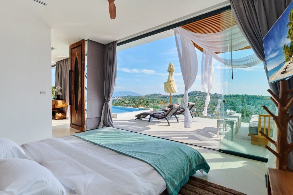 Luxurious honeymoon suite at Magic Suites with open ocean view and private pool.