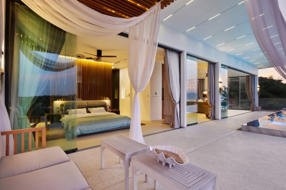 Gorgeous view from the Honeymoon Suite pool area, with curtains and part of the pool visible.