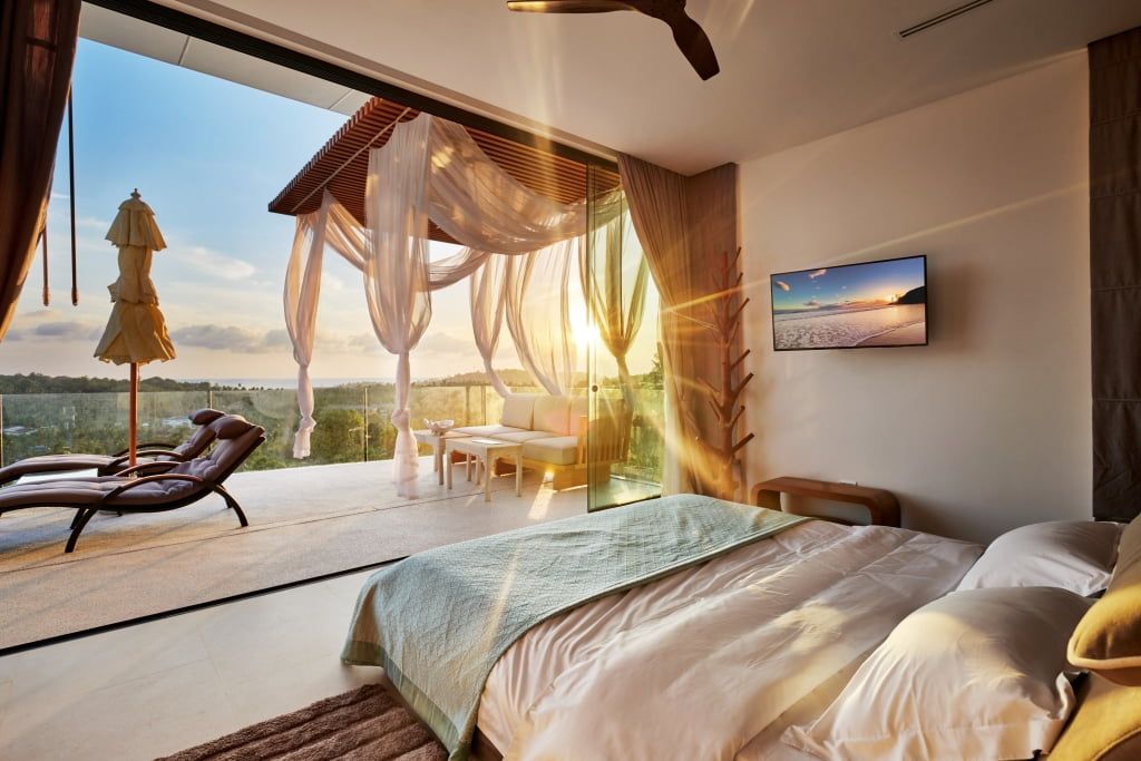 Stunning view from the Honeymoon Suite bedroom in Magic Suites, with sunlight streaming in.