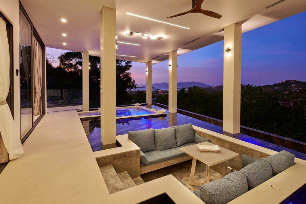 Open-air sala in the 2BR Magic Seaview Jet Plunge Pool Private Suite, featuring a lounging area and pool.