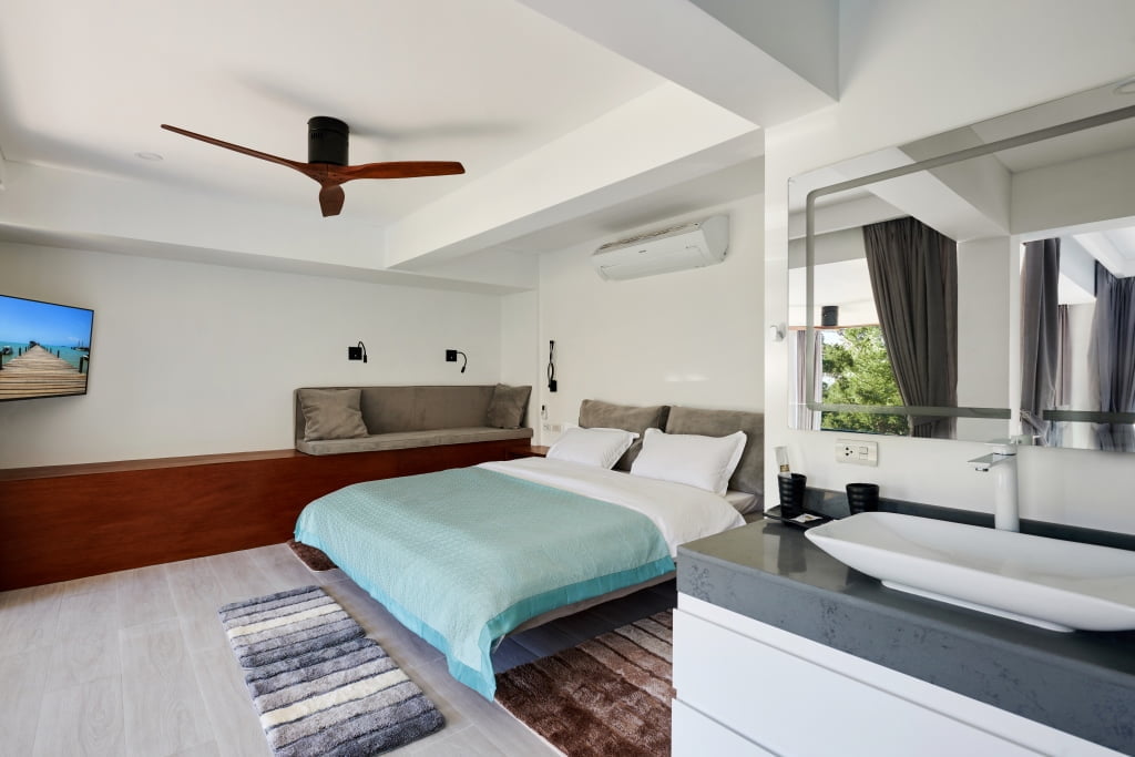 Modern bedroom for couple in the Sunrise jet plunge pool 3BR private suite.