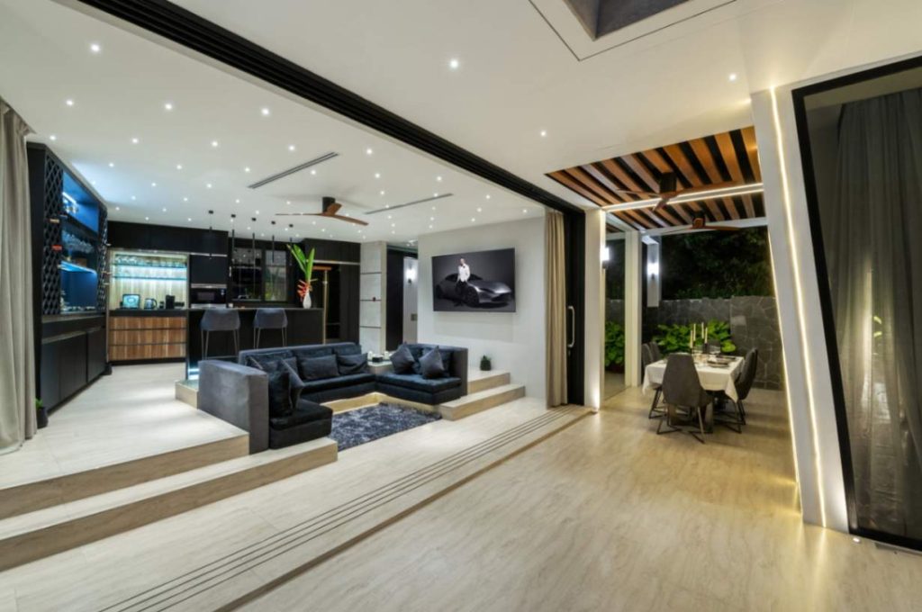 Sleek and modern bar area in Magic Suites with lighting and luxurious design.