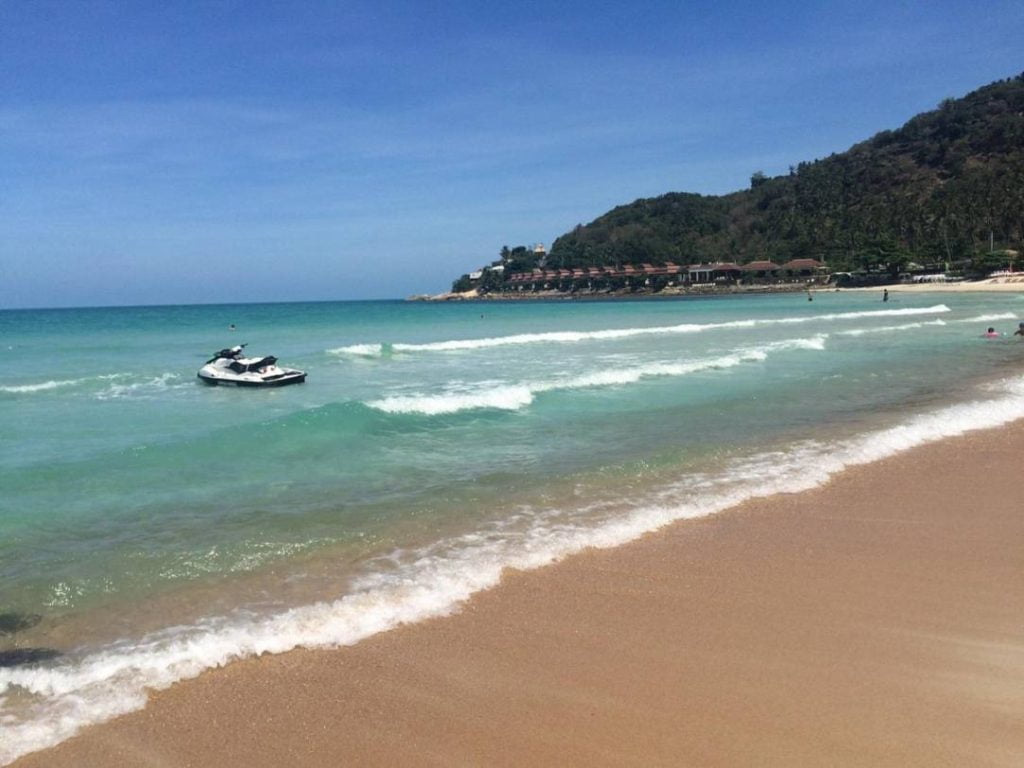 Pristine sand and clear blue water visible in this photo of the Chaweng Noi beach.