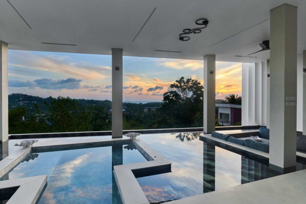 Pool area in the Island Views Jungle Jet Pool villa overlooking the island's greenery.